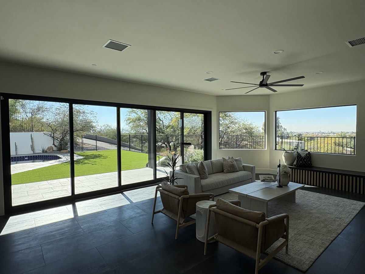Dining area with 4-panel sliding glass door looking out to patio